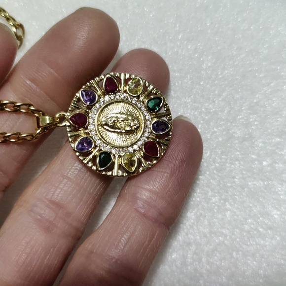 This necklace of the Virgin Mary is multi color and gold the chain is 23 inches - Picture 2 of 7